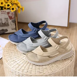 Three pairs of wedge sandals in navy, grey, and beige with hook-and-loop straps