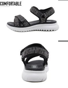Detail view of black platform sandals featuring textured velcro straps and wavy anti-slip sole