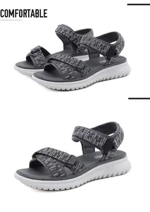 Detail view of dark grey sports sandals featuring thick MD soles and adjustable straps