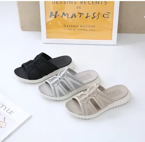Three pairs of thick-soled women's sports sandals in black, grey, and beige with woven straps