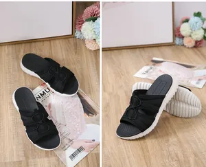Detail view of women's platform sandals featuring black cross straps and thick white MD soles