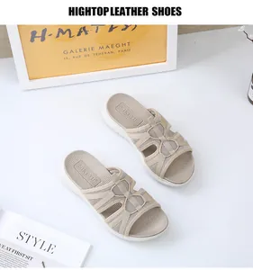 Close-up of beige casual sports sandals with breathable mesh straps and thick white soles