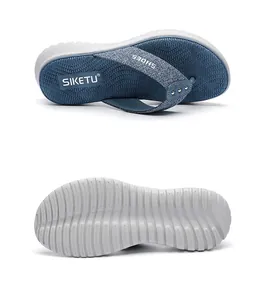 Close-up of non-slip wave texture sole and fabric straps of summer platform flip flops