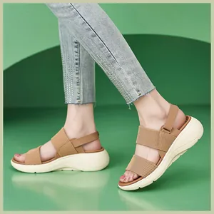 On-foot view of women's platform sandals with khaki elastic straps and white MD outsole