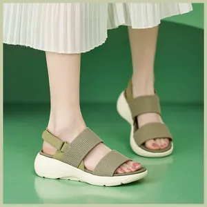 Close-up of olive green platform sports sandals with ribbed straps and velcro closure