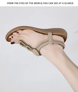 Detail view of Bohemian rhinestone sandals with woven straps and elastic back strap