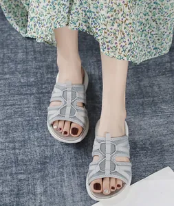 On-foot view of women's gray mesh platform sports sandals with breathable fabric straps