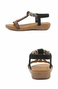 Detail of bohemian T-strap sandals featuring colorful beads and elastic back strap