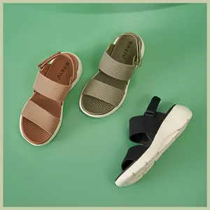 Detailed view of women platform sandals with ribbed fabric straps in brown, green and black