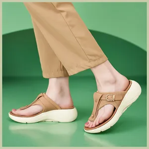 Detail view of beige wedge slide sandals with knit texture and stylish buckle detail