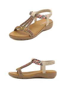 Detailed view of bohemian sandals with beads, rhinestones, and elastic back straps