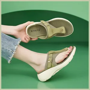 Detailed side view of khaki platform sandal featuring a knitted strap and gold buckle