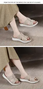 Close-up of beige mesh straps and thick white anti-slip rubber sole on women's sandal