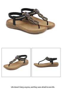Detail of Bohemian flat sandals featuring rhinestones and elastic heel strap for women