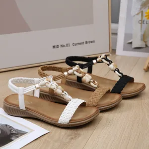 Sandales plates tressées pour femmes avec anneaux marbrés en blanc, marron et noir