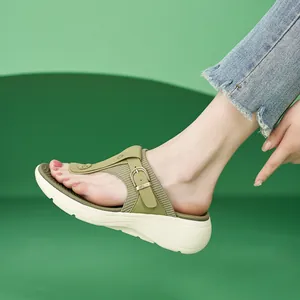 Olive green platform flip flops with metallic buckle and comfortable sport sole