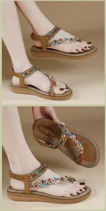 Detalle de sandalias planas bohemias con cuentas de colores y adornos florales de playa