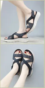 Detail view of platform sandals featuring grey knit fabric and adjustable velcro straps