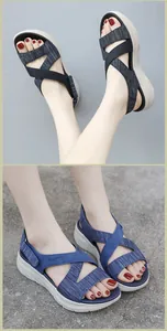 Detail view of comfortable platform sandals with crisscross fabric straps and side logo
