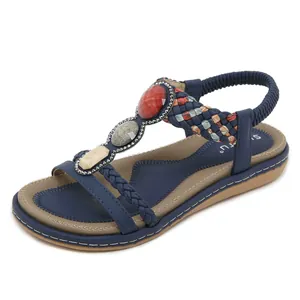 Sandali bassi boho blu navy con pietre decorative e cinturino a T elasticizzato