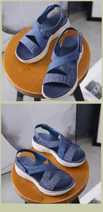 Detail of blue platform sandals with crisscross straps and adjustable velcro back strap