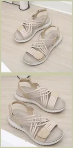 Détail de sandales compensées beige avec sangles tissées élastiques et scratch réglable