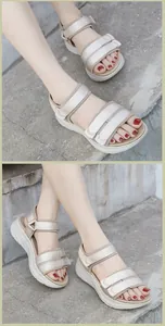 Detail view of beige sporty platform sandals with velcro straps and woven texture surface