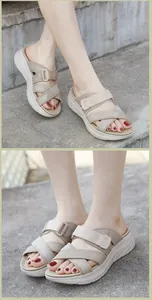 Detail of khaki platform sandal featuring breathable mesh straps and adjustable buckle