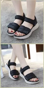 Detail of black sporty platform sandals with adjustable straps and thick anti-slip soles
