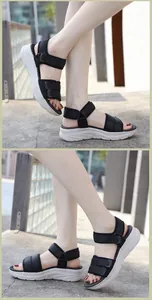 Outdoor close-up of women's chunky platform sandals with adjustable black straps