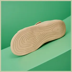 Detailed view of beige wedge sandal sole with wave texture and size 36 engraving