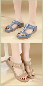 Detail view of Bohemian rhinestone sandals with latex massage footbed in blue and beige