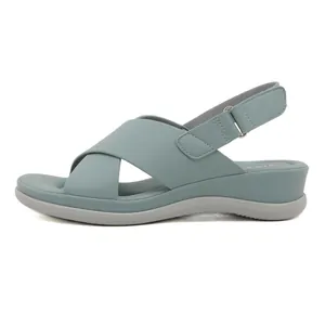 Women's platform wedge sandals with dusty blue crisscross straps and velcro closures