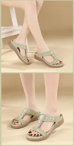 Detail view of Bohemian rhinestone mule sandals with cushioned sole and olive green upper