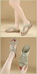 Detail of bohemian wedge sandals featuring rhinestones and latex massage footbed