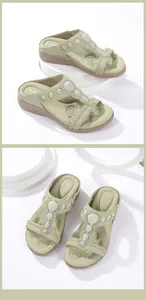 Detail of bohemian wedge sandals featuring sage green straps and sparkling rhinestone accents
