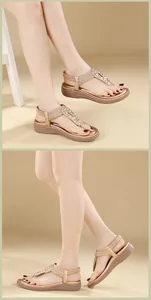 Detail of champagne gold bohemian wedge sandals with sparkling rhinestones and elastic strap