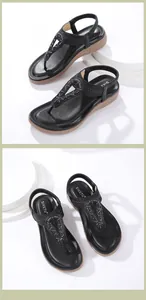 Detail of bohemian black T-strap sandals with rhinestone accents and elastic heel strap