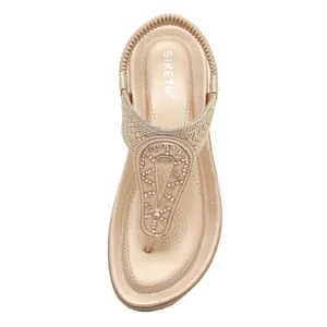 Champagne gold flat bohemian sandals with sparkling rhinestones and T-strap elastic back