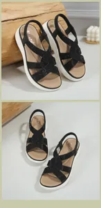Dettaglio dei cinturini incrociati con strass e tacco elastico di questi sandali platform