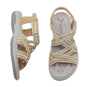 Women's woven wedge sandals with beige and grey crisscross straps and elastic backstrap