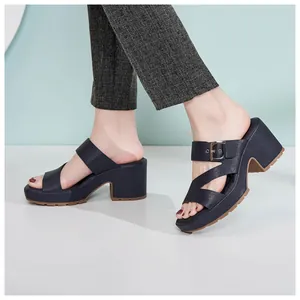 Detail view of platform mule sandals with metal buckle and anti-slip rubber sole