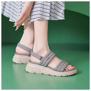 Side view of comfortable platform sandals featuring quilted grey straps and non-slip sole
