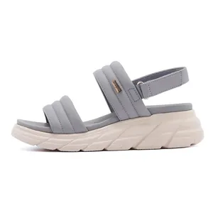Detailed side view of platform sports sandals with quilted blue straps and thick EVA soles