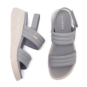 Dual view of grey platform sandals showing quilted straps and cushioned footbed detail
