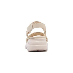 Rear view of beige platform sandals highlighting the wedge heel and adjustable strap
