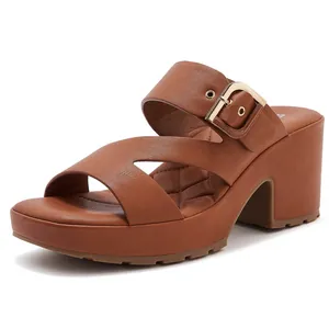 Brown platform sandals with block heels, leather texture, and gold buckle details