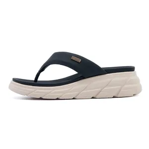 Side view of women's platform flip flops with metallic logo and textured sole