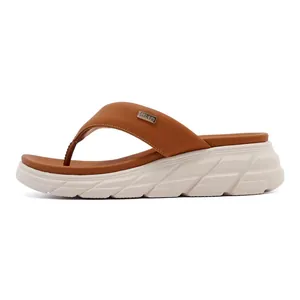 Detailed side view of camel brown leather flip-flops with thick off-white anti-slip sole