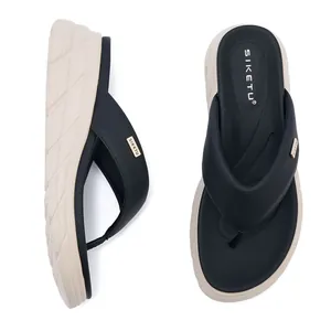 Detail view of anti-slip platform flip flops with gold logo and comfortable soft sole